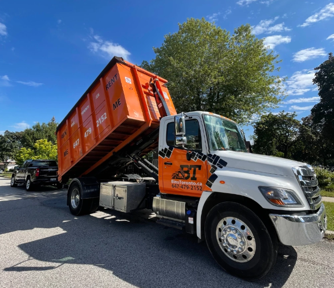 Dumpster Express roll-off delivery truck